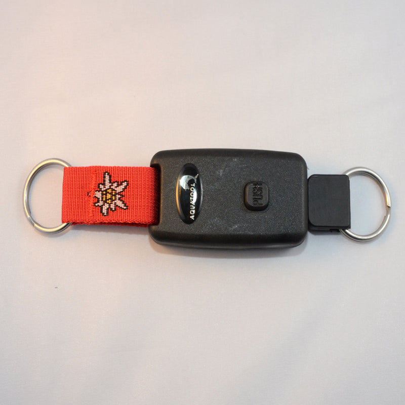 Laden Sie das Bild in Galerie -Viewer, Arretierbarer Retractor mit beidseitigem Inox Splittring 32mm, Seillänge ca. 50cm